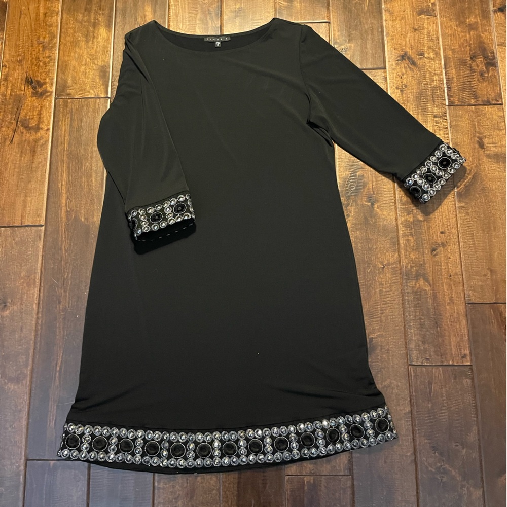 Black dress trimmed in sequins/silver thread